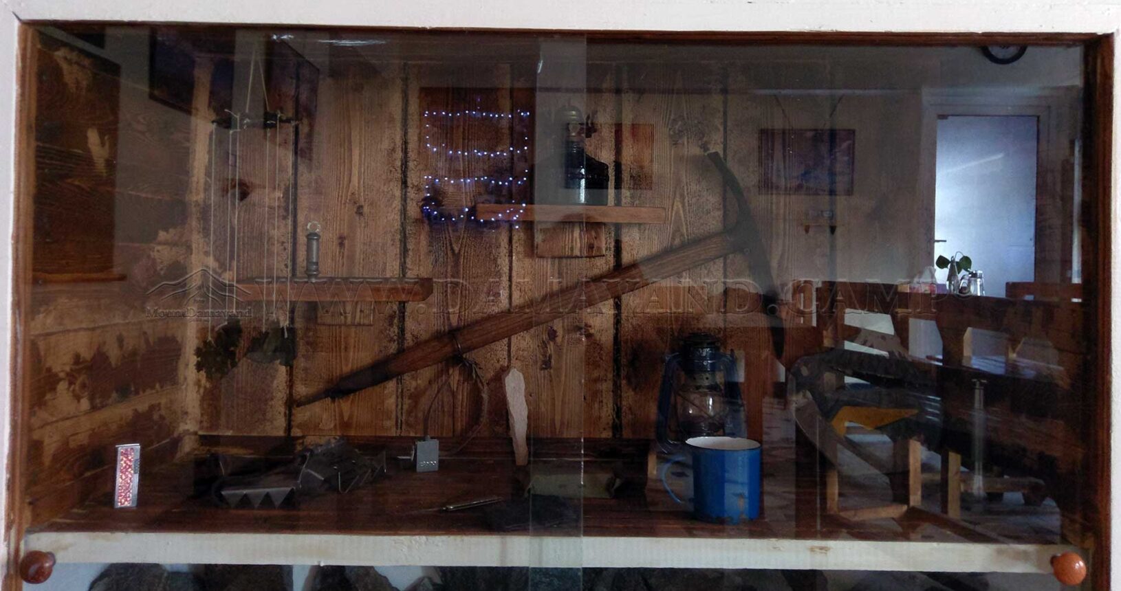 Old mountain gears in vitrine at Camp 1, Ice axe and other equipment.