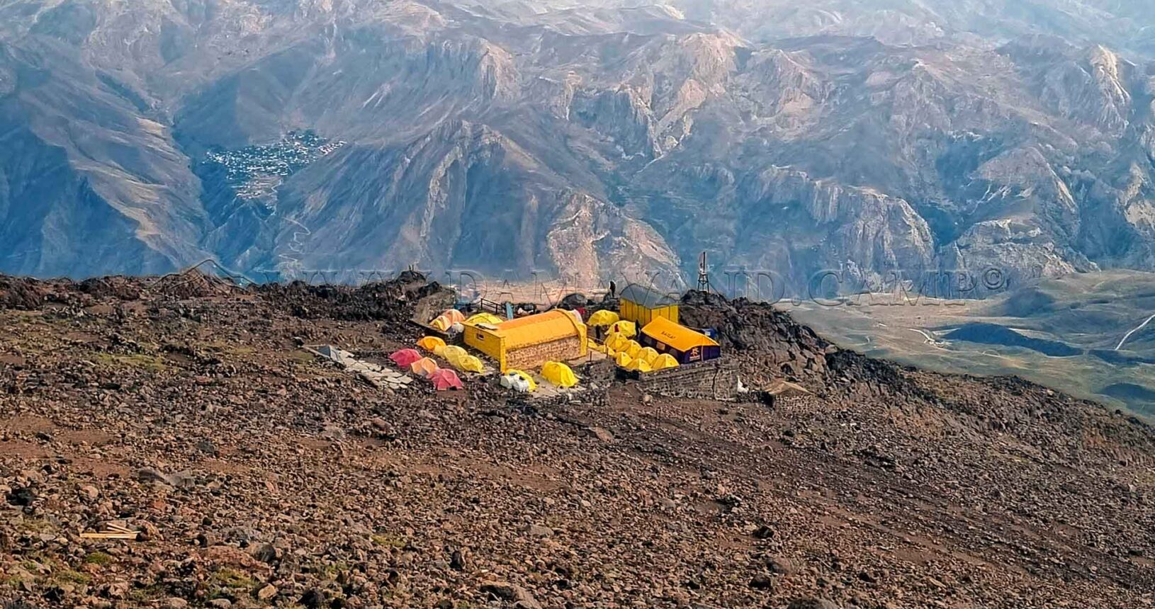 View from higher altitudes: The old hut and tents of the Mount Damavand Group at Camp 3 on Mount Damavand.