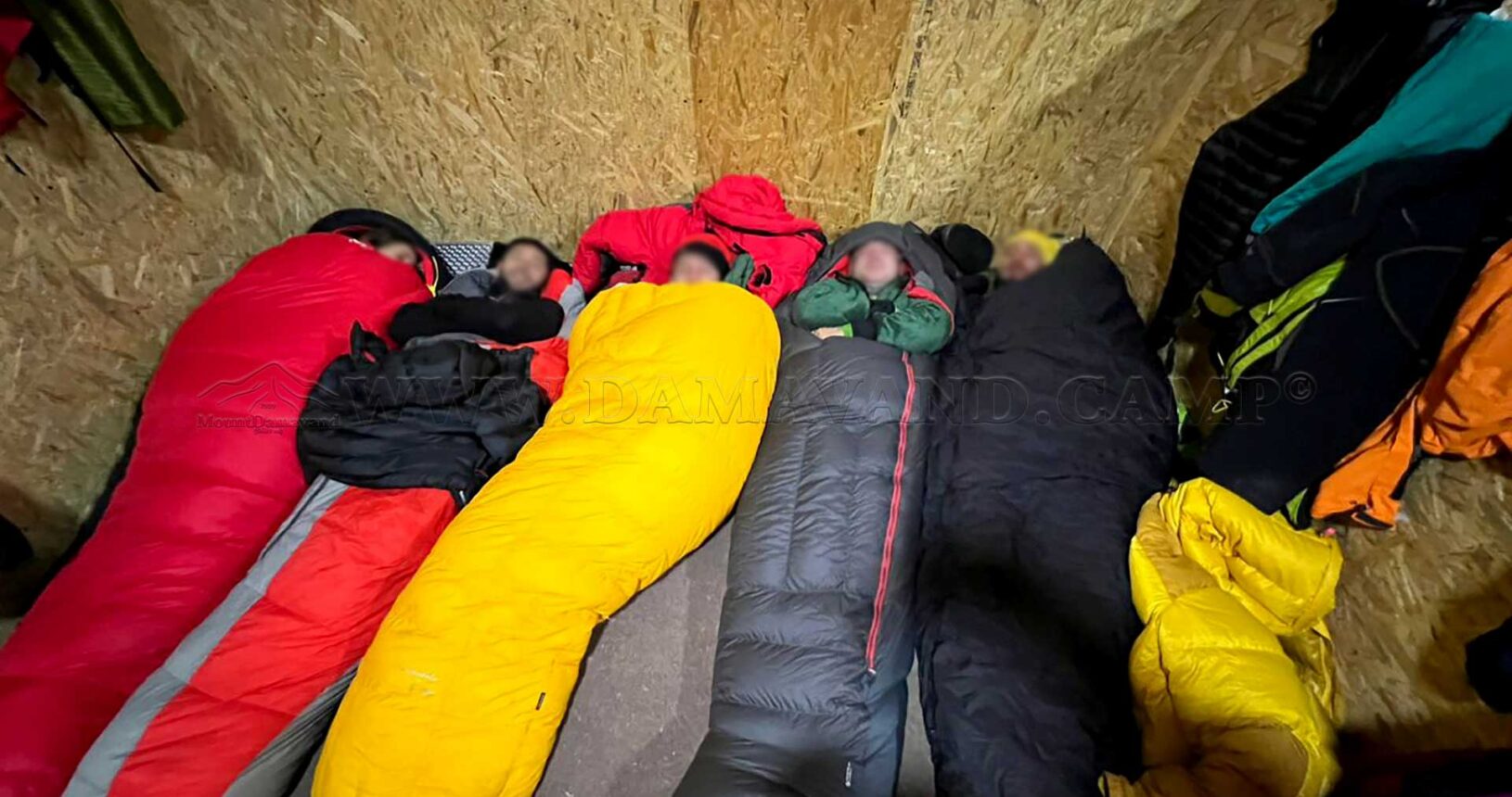 Night at Damavand: Climbers tucked into their sleeping bags for an overnight stay in the old hut (VIP hut) at Camp 3.