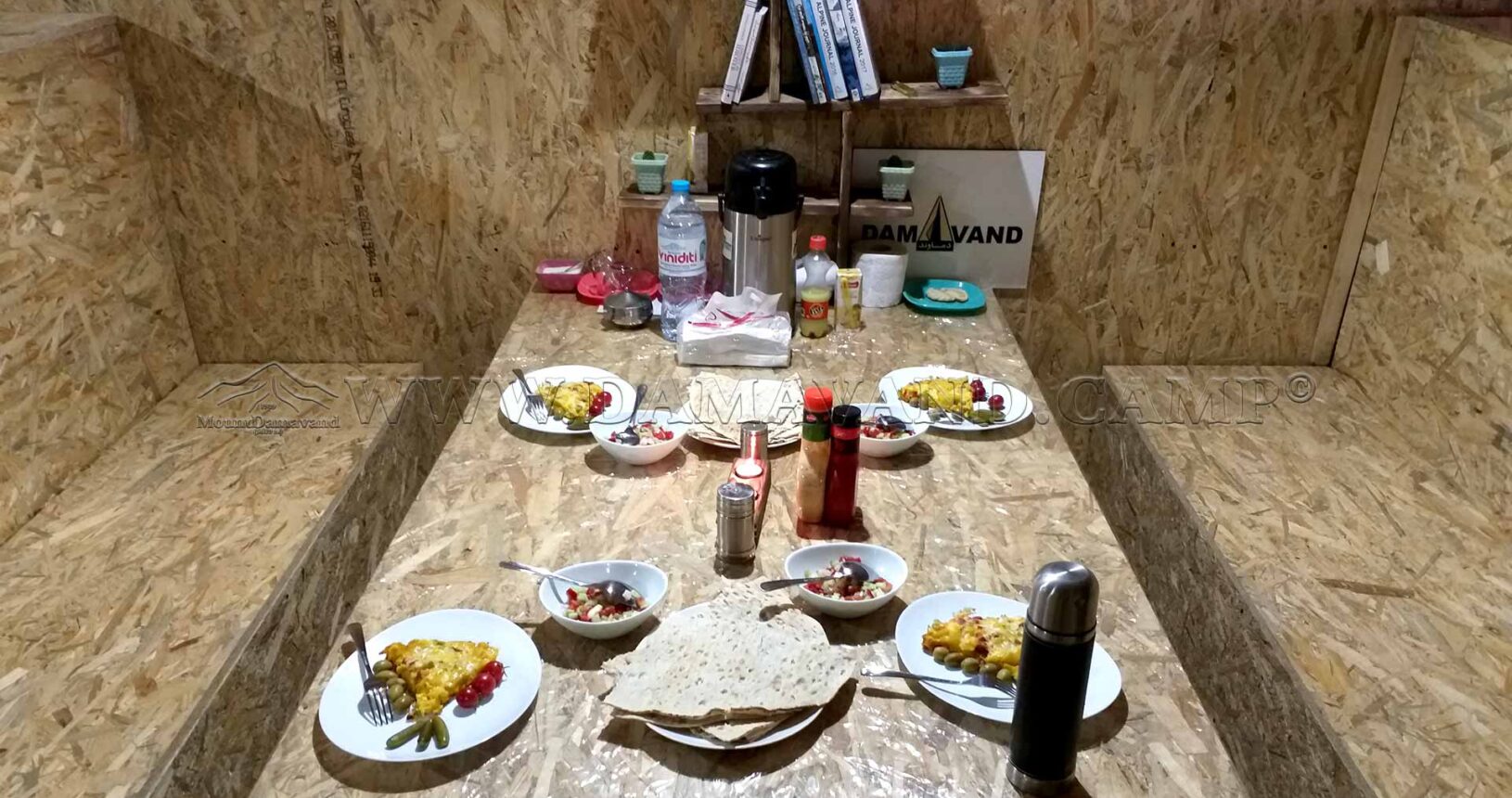 Dining at Damavand: A table set with meals for climbers in the old hut at Camp 3.